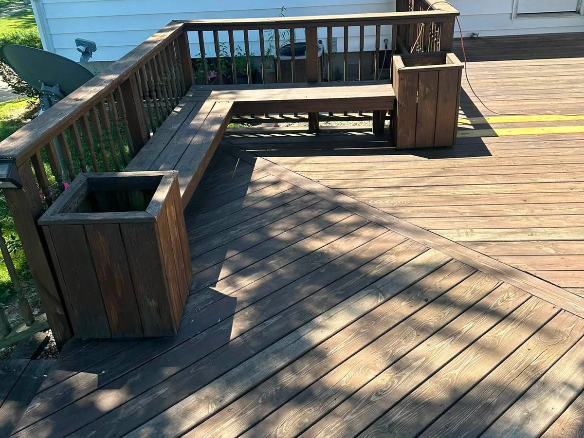 Wood deck with built-in bench seating and matching planter boxes