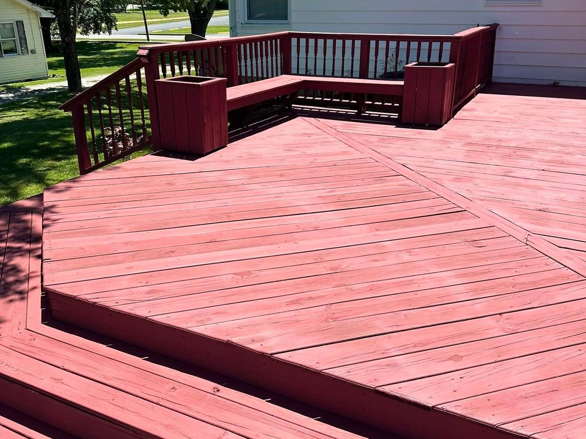 Freshly stained wraparound deck with built-in planters